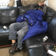 Caswell’s friend Tim demonstrates the couch-as-living-quarters.